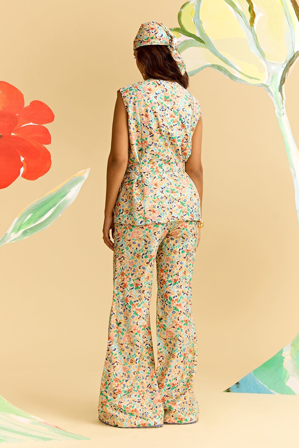 Ivory Multicoloured Printed Chanderi Sleeveless Shirt Paired With Flared Pants And Tie Up Belt