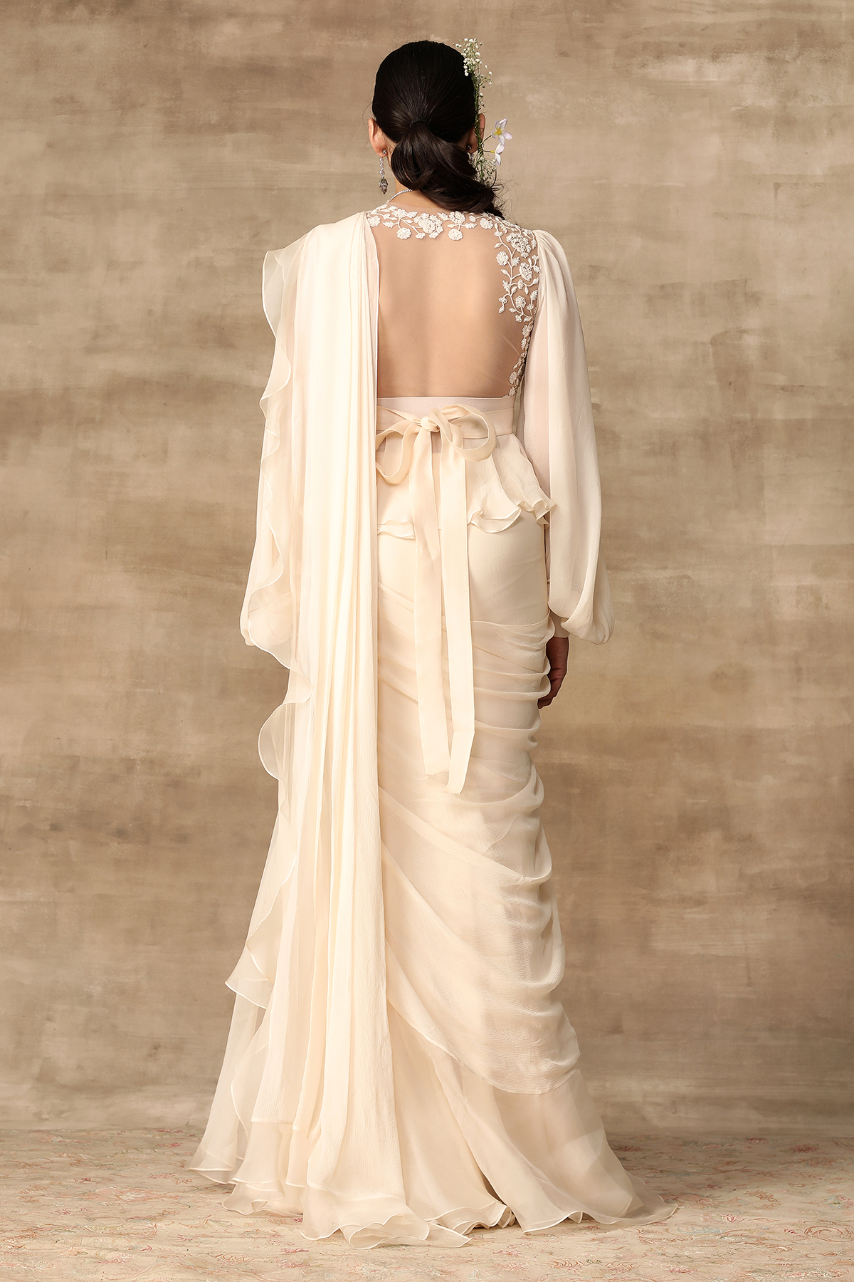 RIDHI MEHRA Ivory embroidered net-chiffon peplum with exaggerated sleeves paired with chiffon-organza draped ruffle saree.