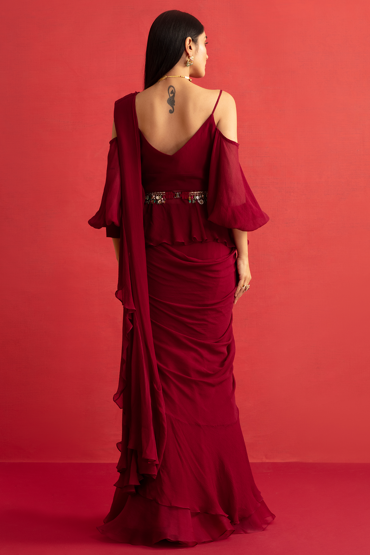 RIDHIMEHRA-Deep Fuschia chiffon peplum and chiffon-organza draped ruffle saree paired with jeweled embroidered belt.