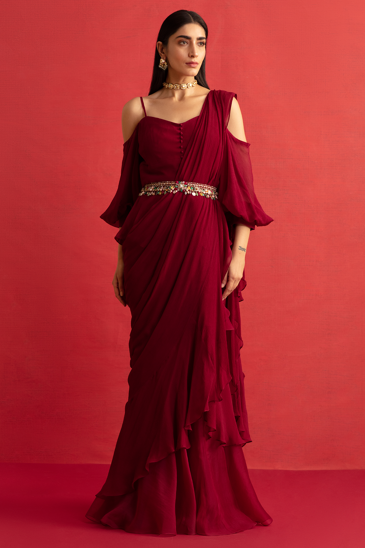 RM-Deep Fuschia chiffon peplum and chiffon-organza draped ruffle saree paired with jeweled embroidered belt.