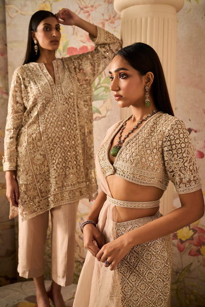 Ridhi-Mehra-Champagne net embroidered blouse and embroidered skirt paired with organza drape and embroidered belt